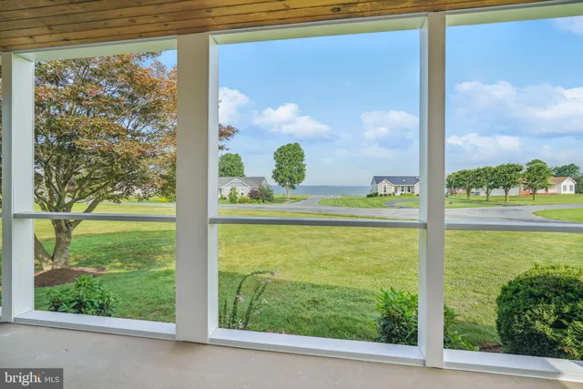 a kitchen with granite countertop white cabinets and stainless steel appliances