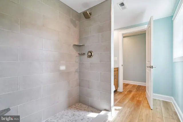 a hallway with a sink and a stove top oven