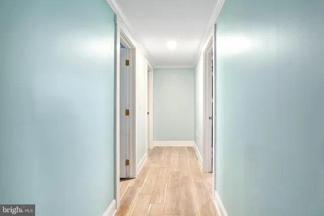 a view of a room with window and wooden floor