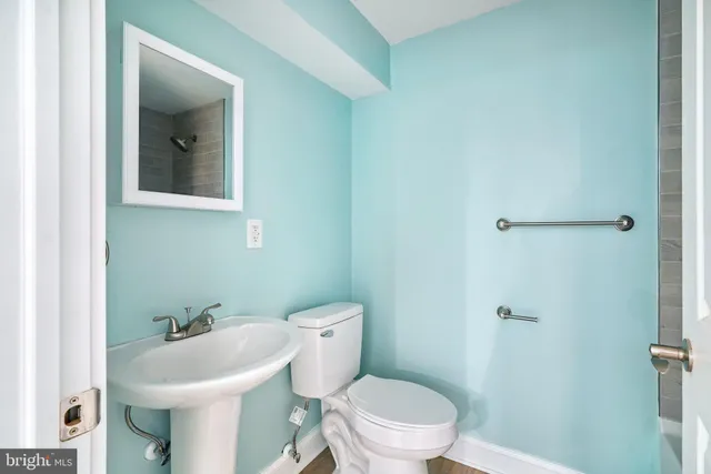 a front view of a house with a garden and yard