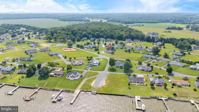 an aerial view of a swimming pool with garden