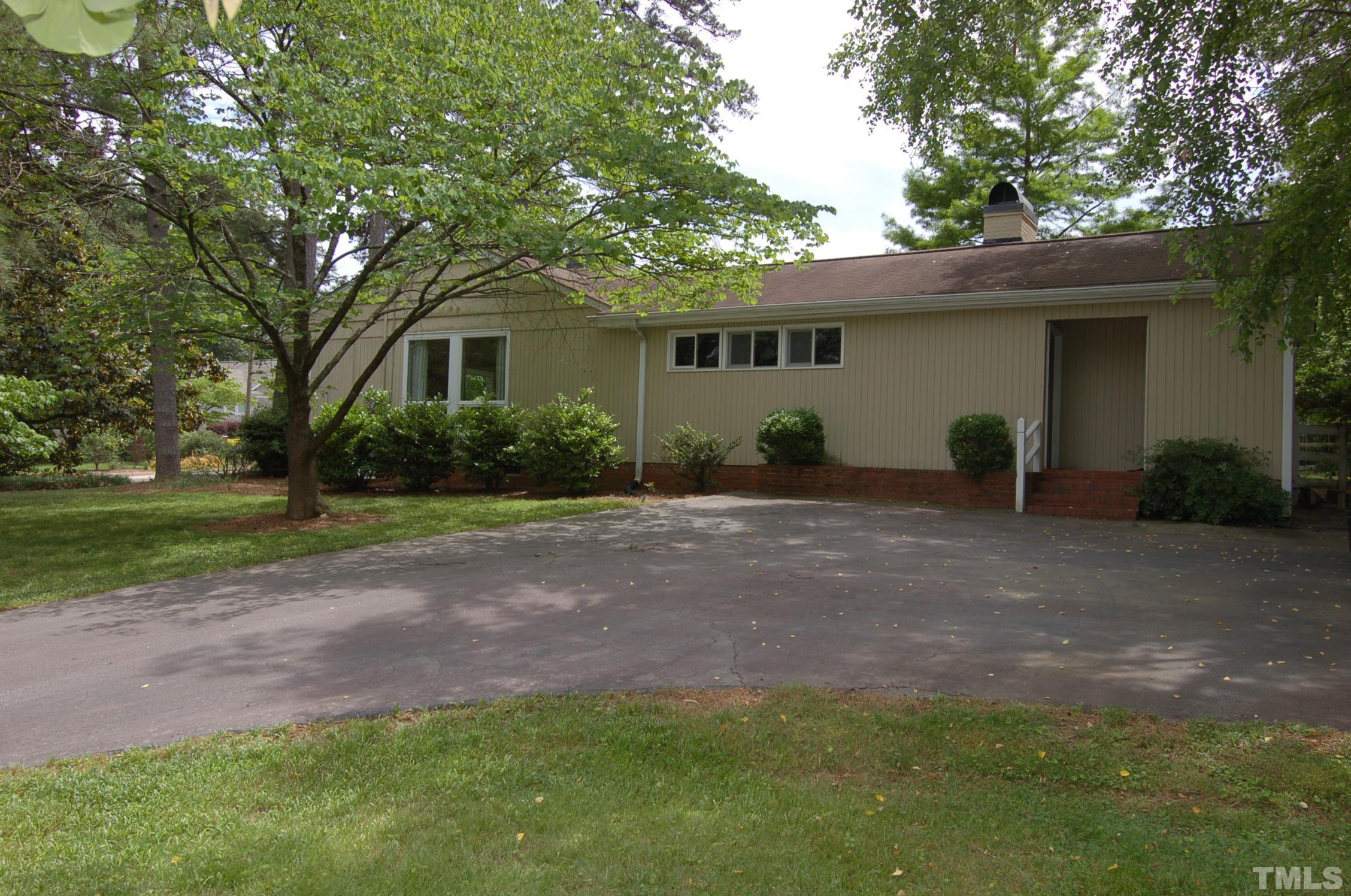 1113 Dogwood Lane Raleigh, NC 27607 - Photo 13 of 14 a view of a house with backyard and a tree