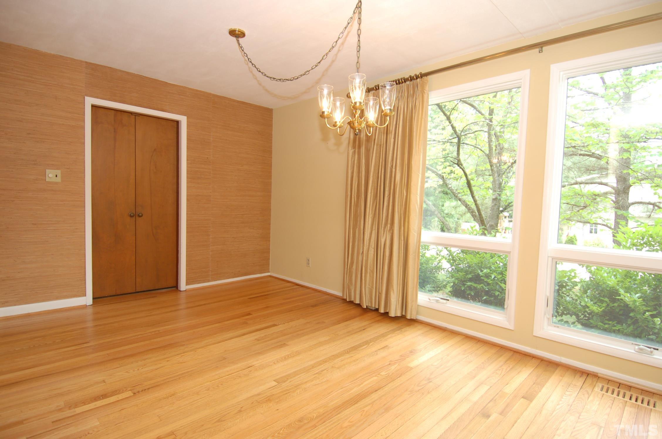 1113 Dogwood Lane Raleigh, NC 27607 - Photo 3 of 14 a view of empty room with wooden floor and fan
