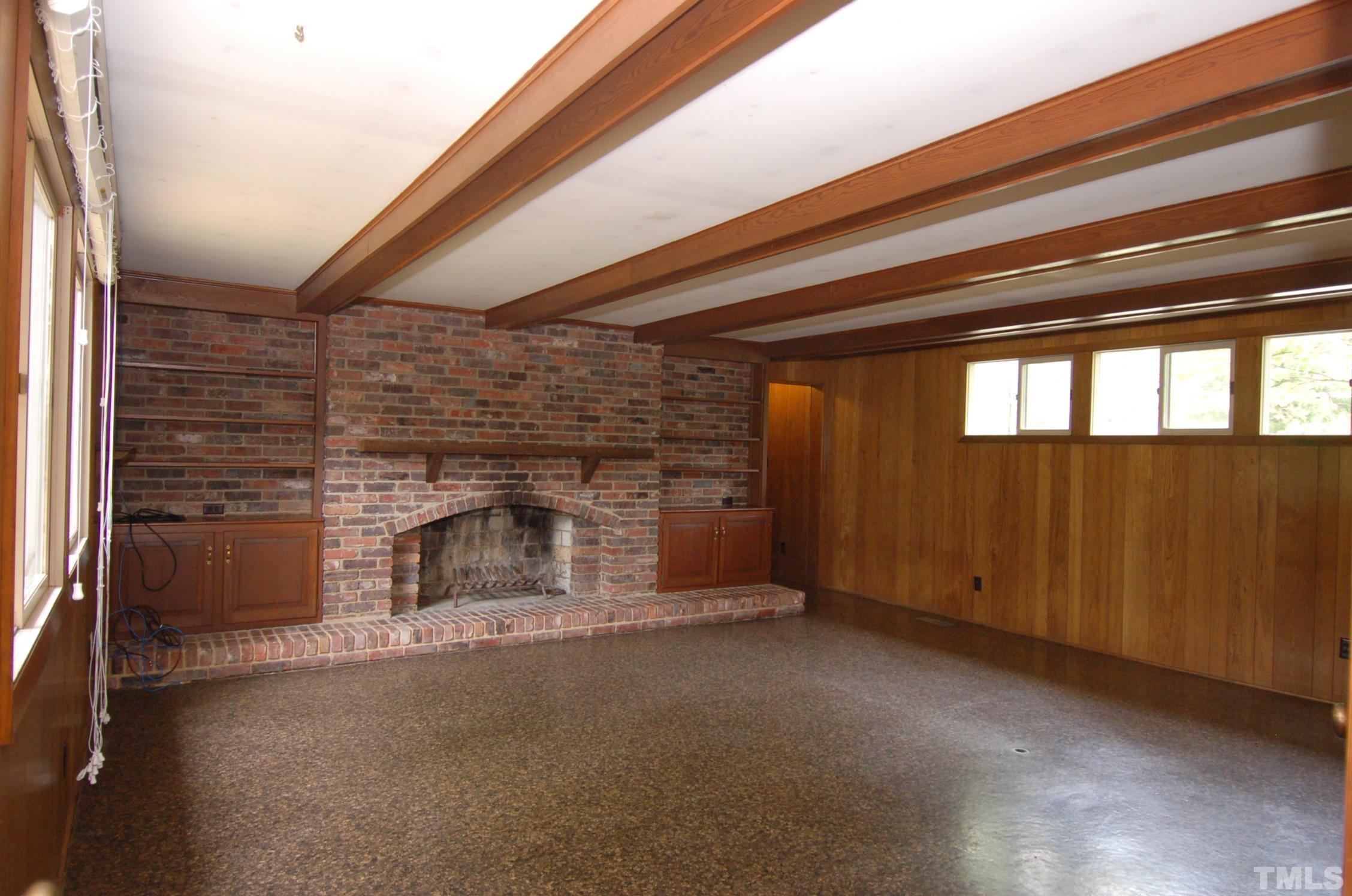 1113 Dogwood Lane Raleigh, NC 27607 - Photo 6 of 14 a view of empty room with a fireplace