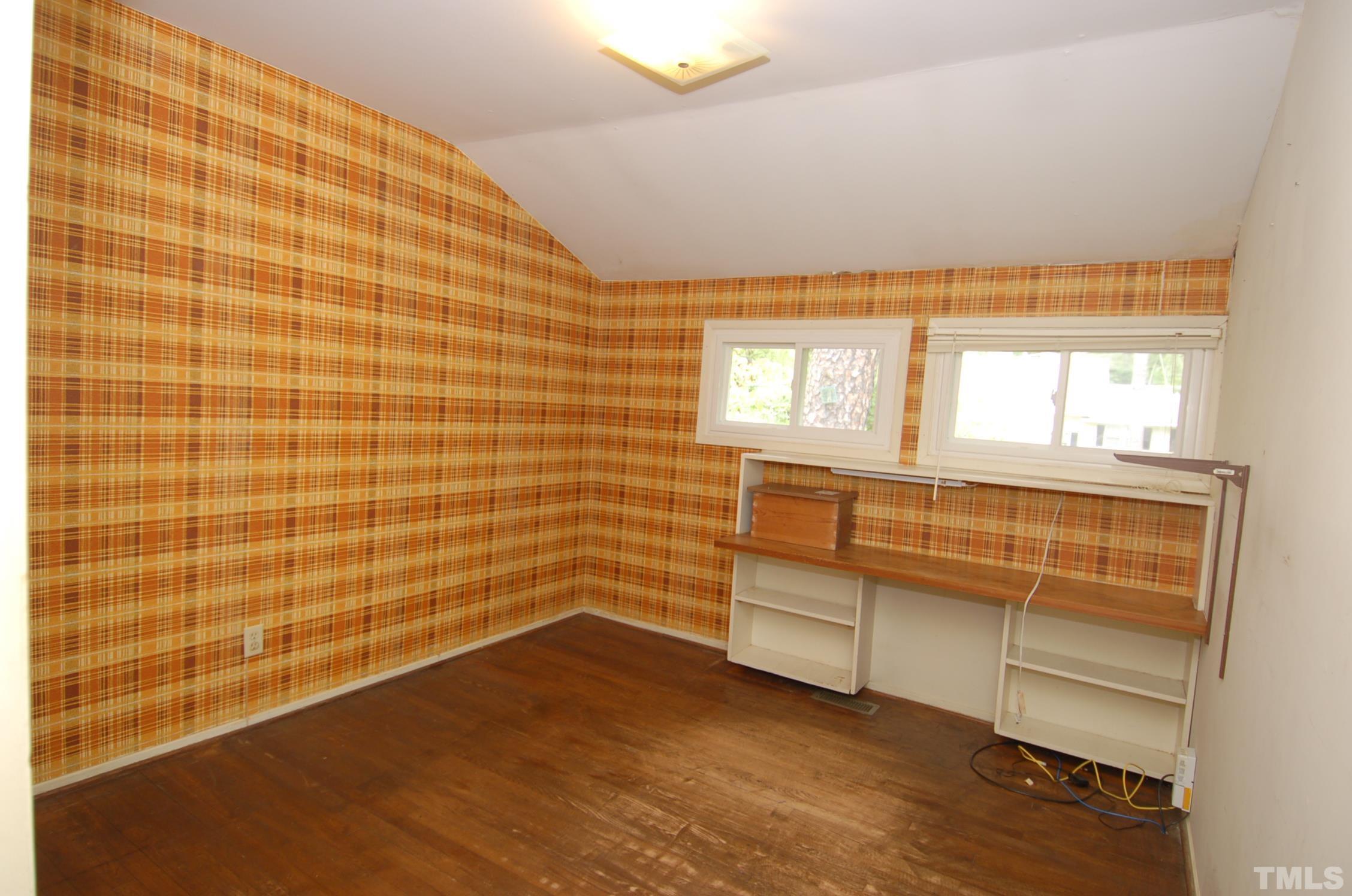 1113 Dogwood Lane Raleigh, NC 27607 - Photo 7 of 14 a view of a room with cabinet and windows