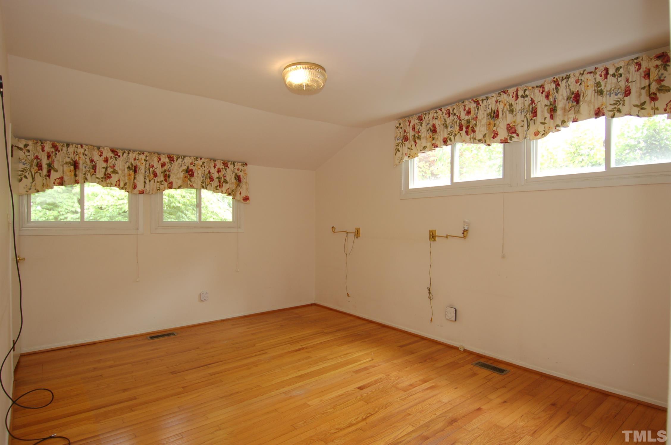 1113 Dogwood Lane Raleigh, NC 27607 - Photo 10 of 14 a view of empty room with window