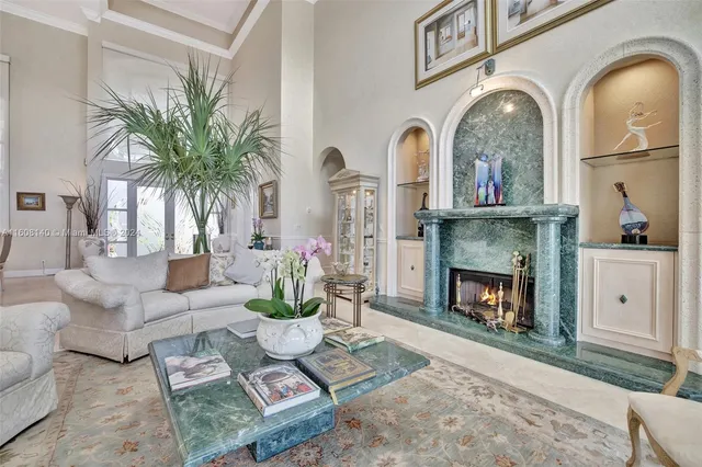 a living room with furniture and kitchen view