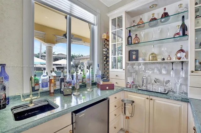 a living room with furniture and painting on the wall