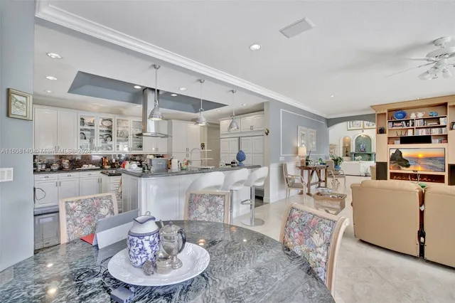 a view of a chair and tables in the balcony
