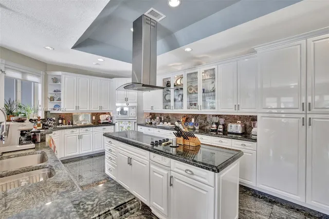 a view of yard from deck with patio