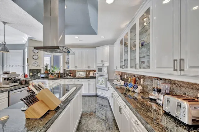 a bathroom with a sink vanity tub and a mirror