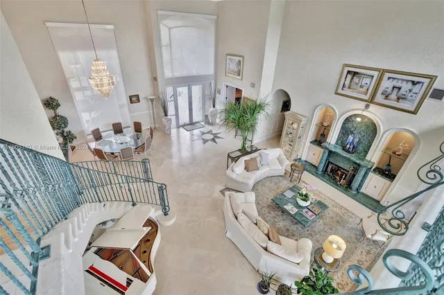 a bedroom with furniture and a chandelier