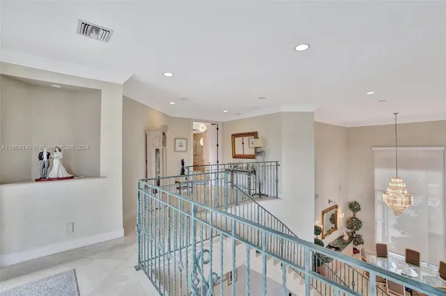 a bed room with a bed and a chandelier