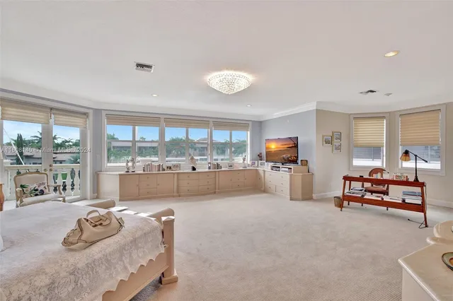 a bathroom with a granite countertop sink toilet mirror and shower