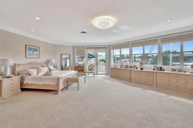 a view of a patio with a table and chairs under an umbrella