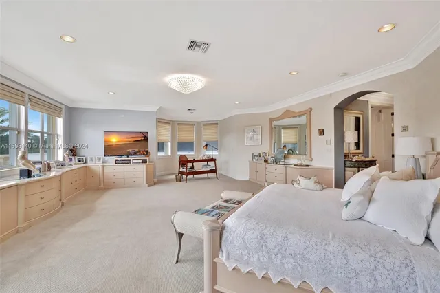 a view of a swimming pool with a patio and a yard