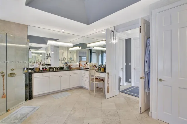 a view of a cafe with table and chairs under an umbrella