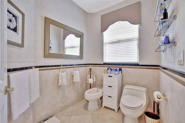 a kitchen with a stove and a white cabinets