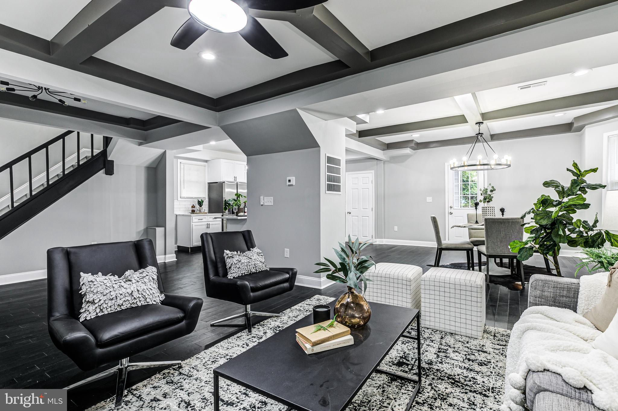 5011 Catalpha Road Baltimore, MD 21214 - Photo 12 of 42 a living room with furniture and a table