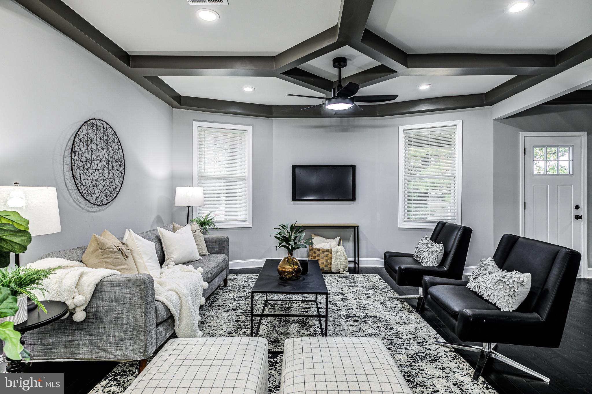 5011 Catalpha Road Baltimore, MD 21214 - Photo 2 of 42 a living room with furniture and a large window