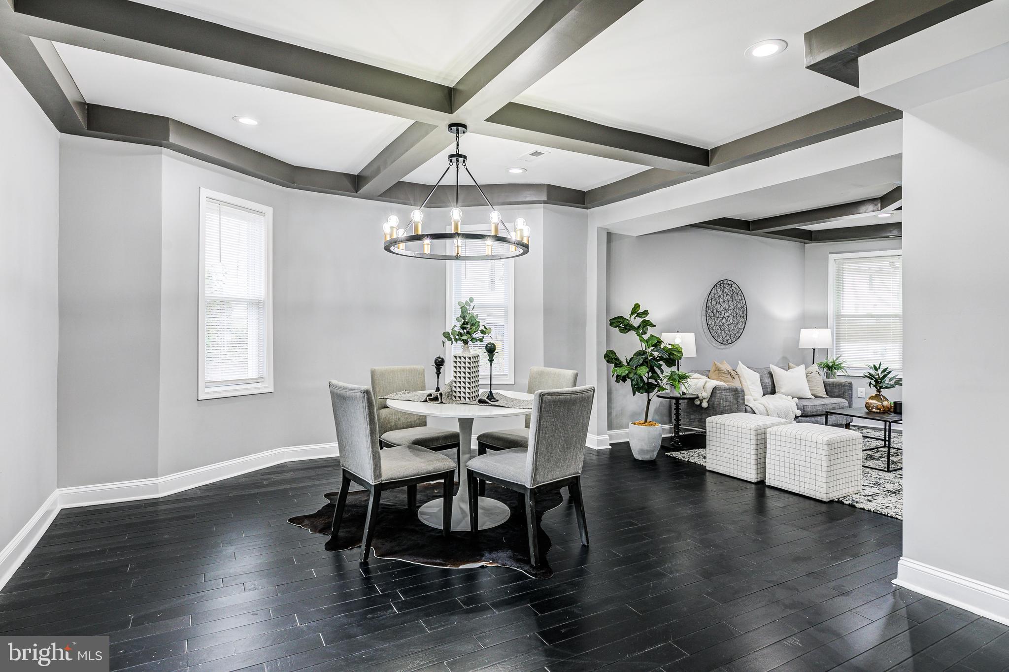5011 Catalpha Road Baltimore, MD 21214 - Photo 21 of 42 a view of a dining room with furniture wooden floor and chandelier