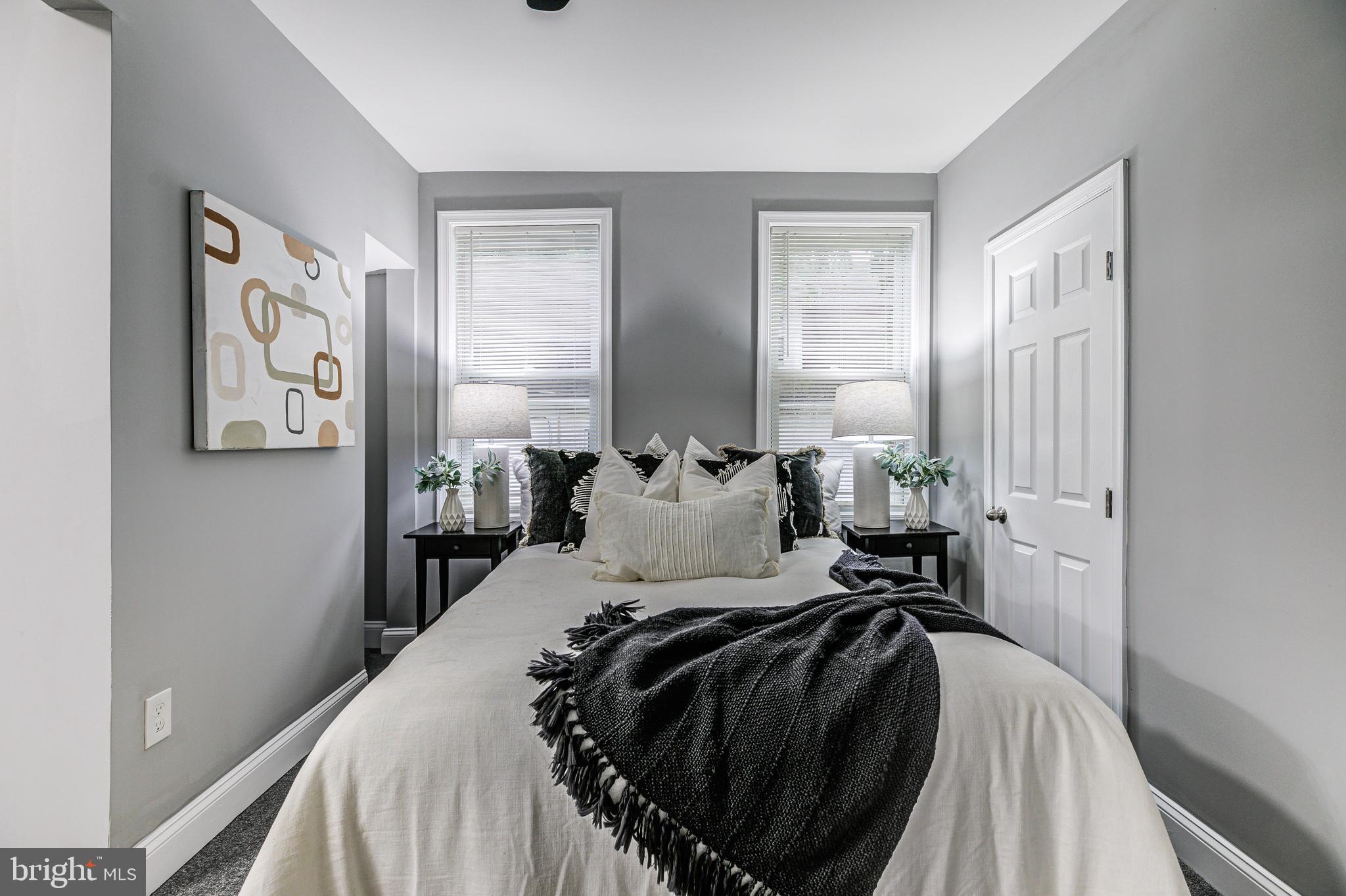 5011 Catalpha Road Baltimore, MD 21214 - Photo 27 of 42 a bed room with a bed and a window