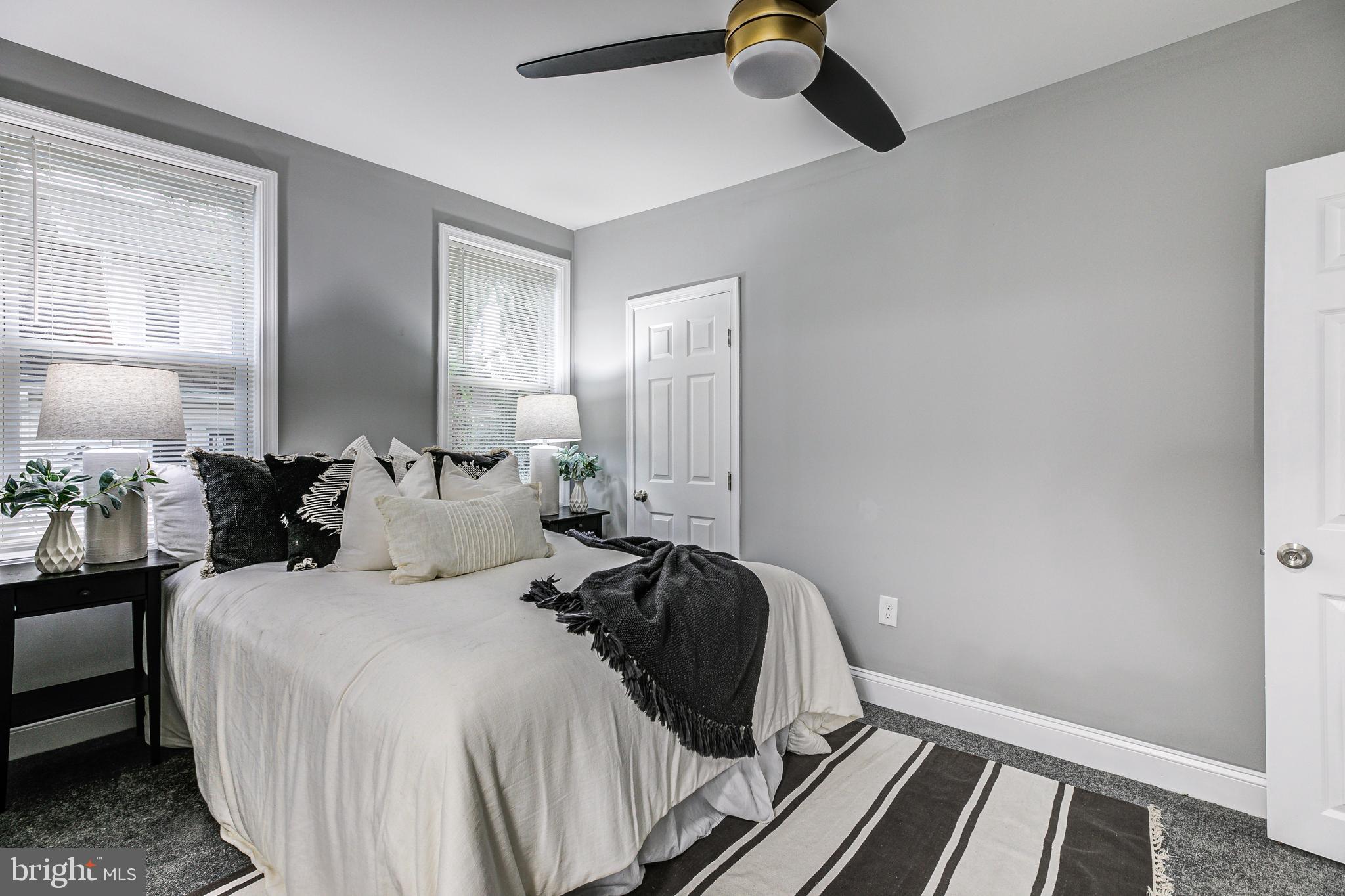 5011 Catalpha Road Baltimore, MD 21214 - Photo 28 of 42 a bedroom with double bed and a window