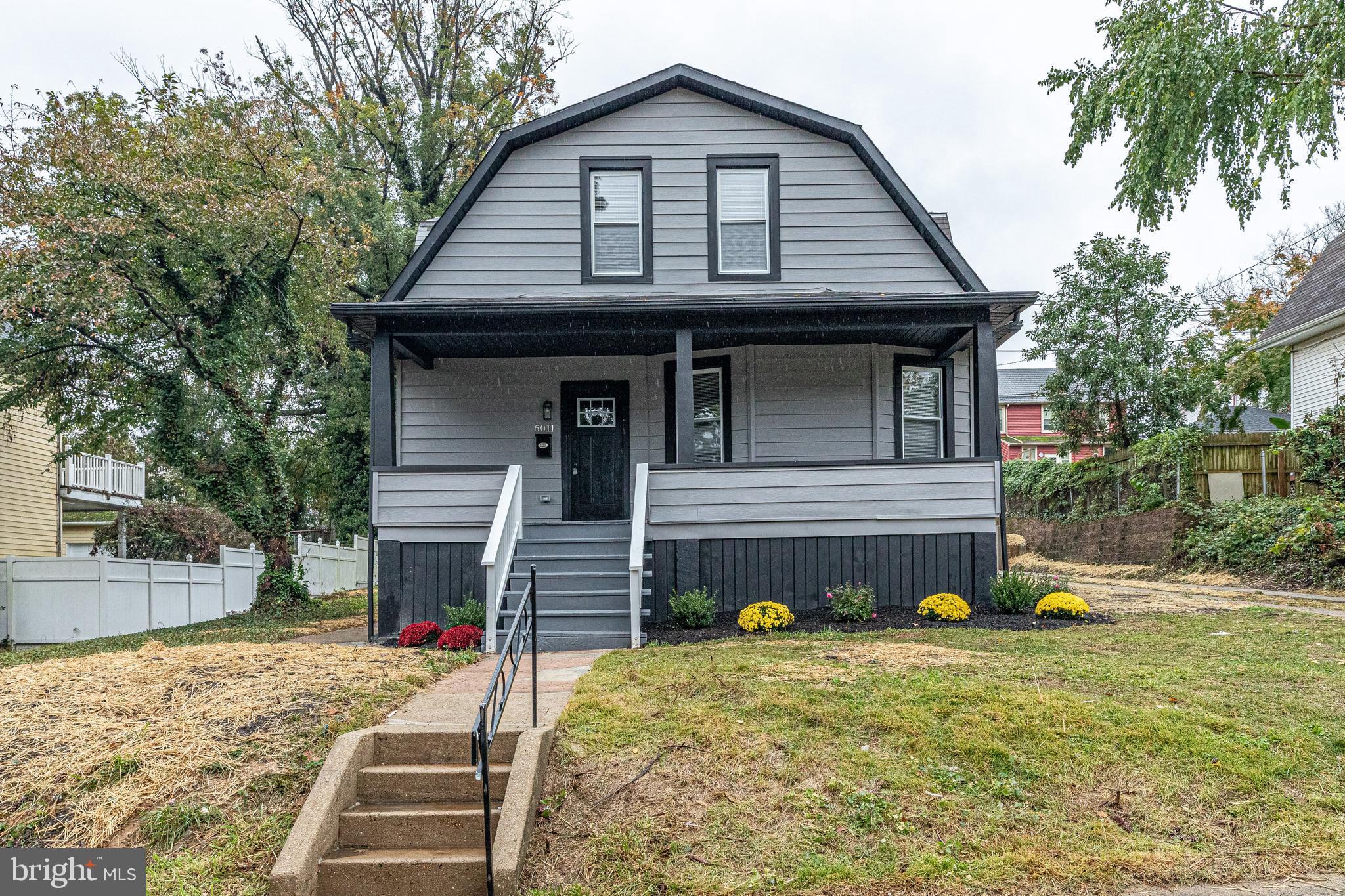 5011 Catalpha Road Baltimore, MD 21214 - Photo 3 of 42 a front view of a house with garden
