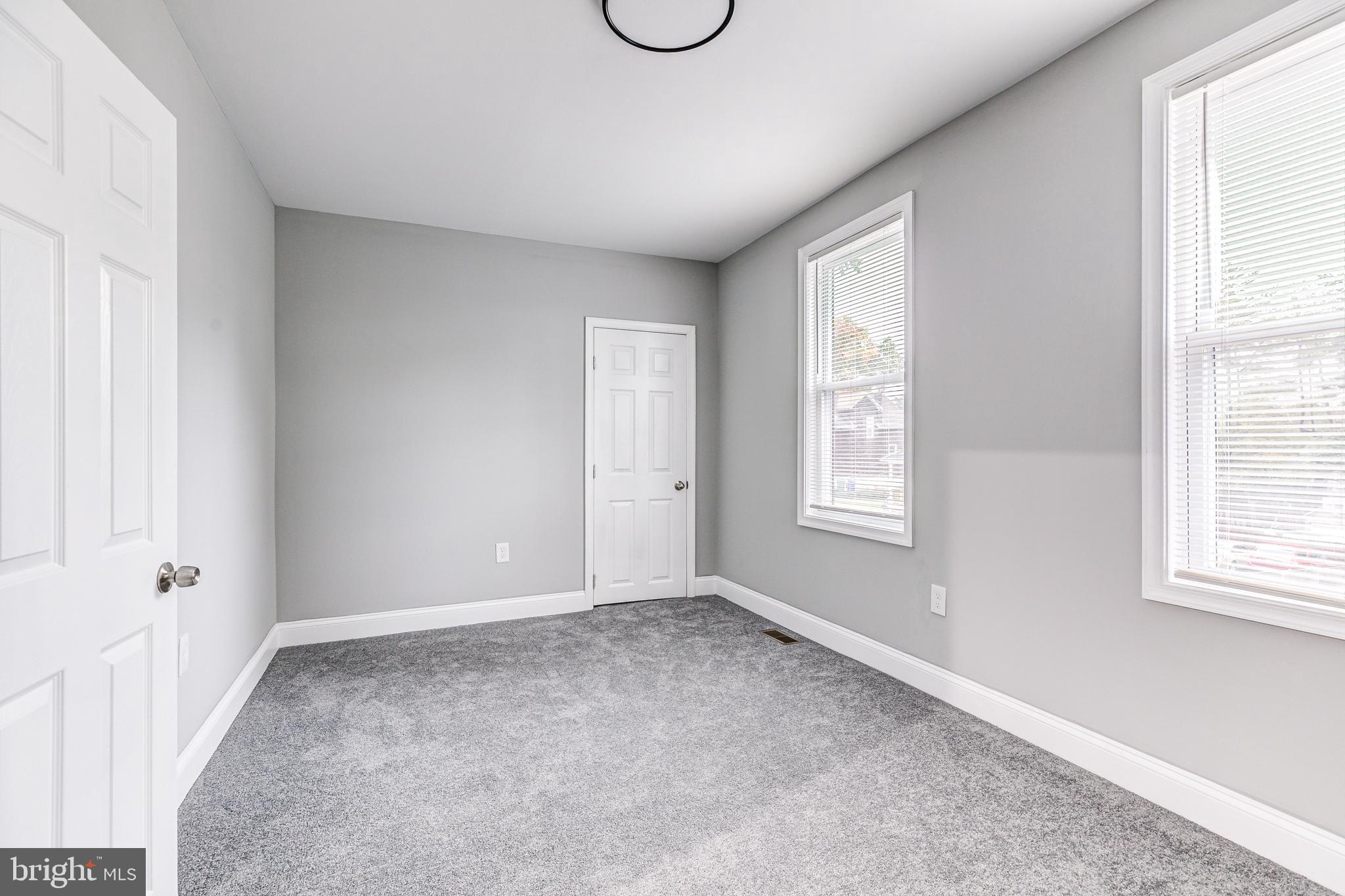 5011 Catalpha Road Baltimore, MD 21214 - Photo 31 of 42 a view of an empty room with a window