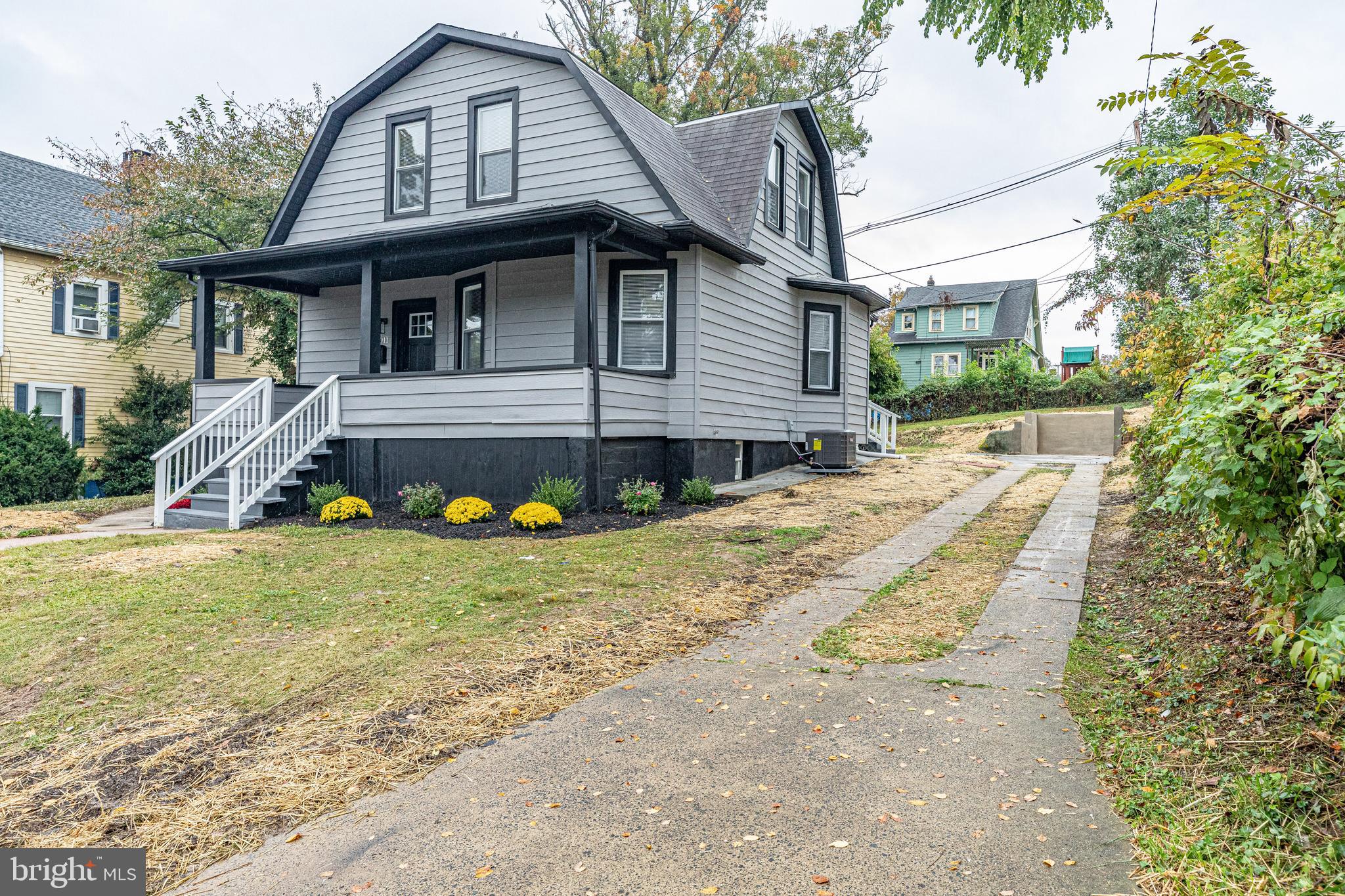5011 Catalpha Road Baltimore, MD 21214 - Photo 4 of 42 a view of a house with backyard and a tree