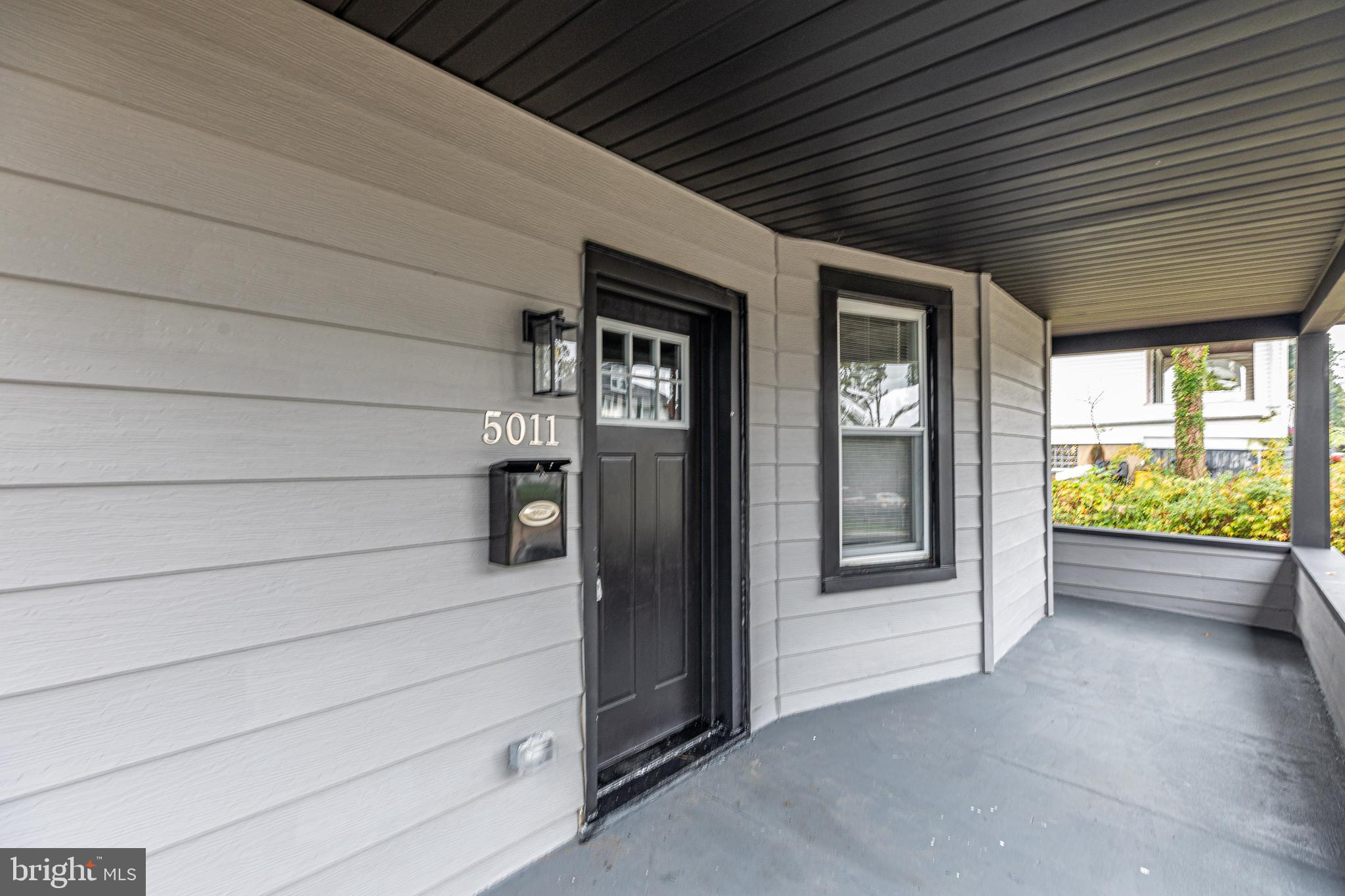 5011 Catalpha Road Baltimore, MD 21214 - Photo 7 of 42 a view of front door and stairs
