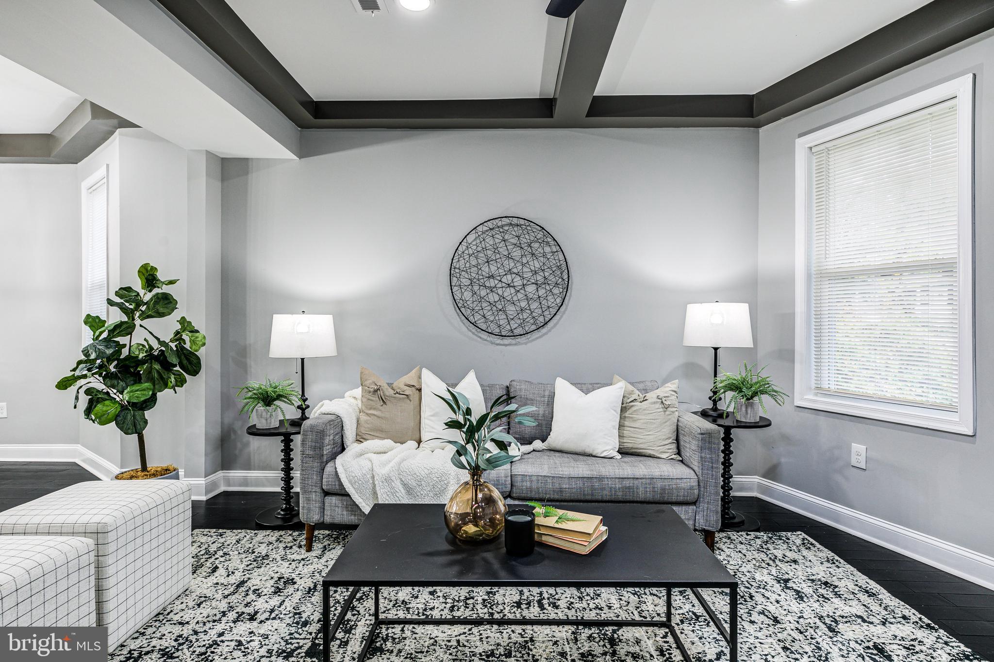 5011 Catalpha Road Baltimore, MD 21214 - Photo 10 of 42 a living room with furniture and a table