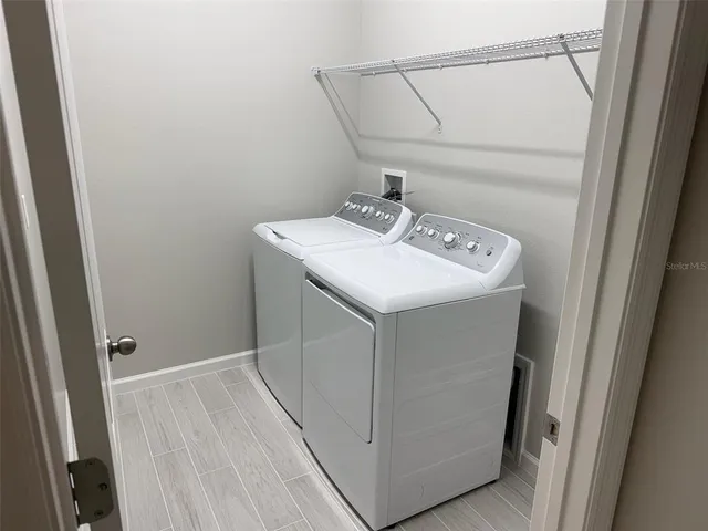 a utility room with dryer and washer