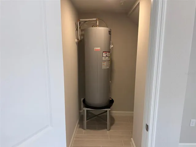 a balcony with table and chairs