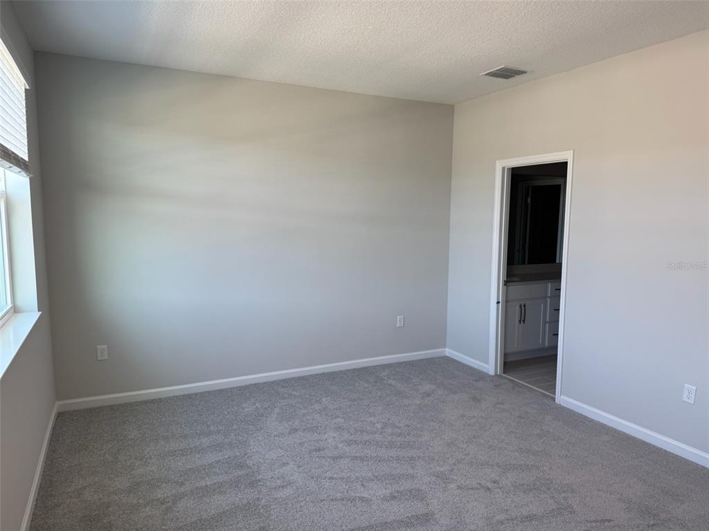 611 Pothos Street Apopka, FL 32703 - Photo 19 of 34 an empty room with windows