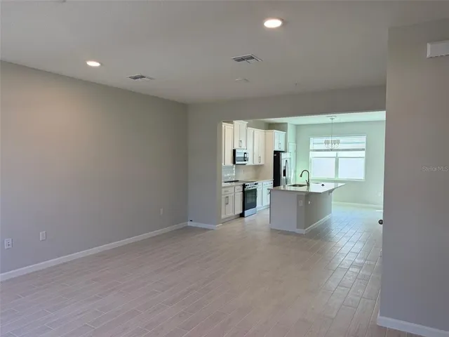 a view of kitchen and windows