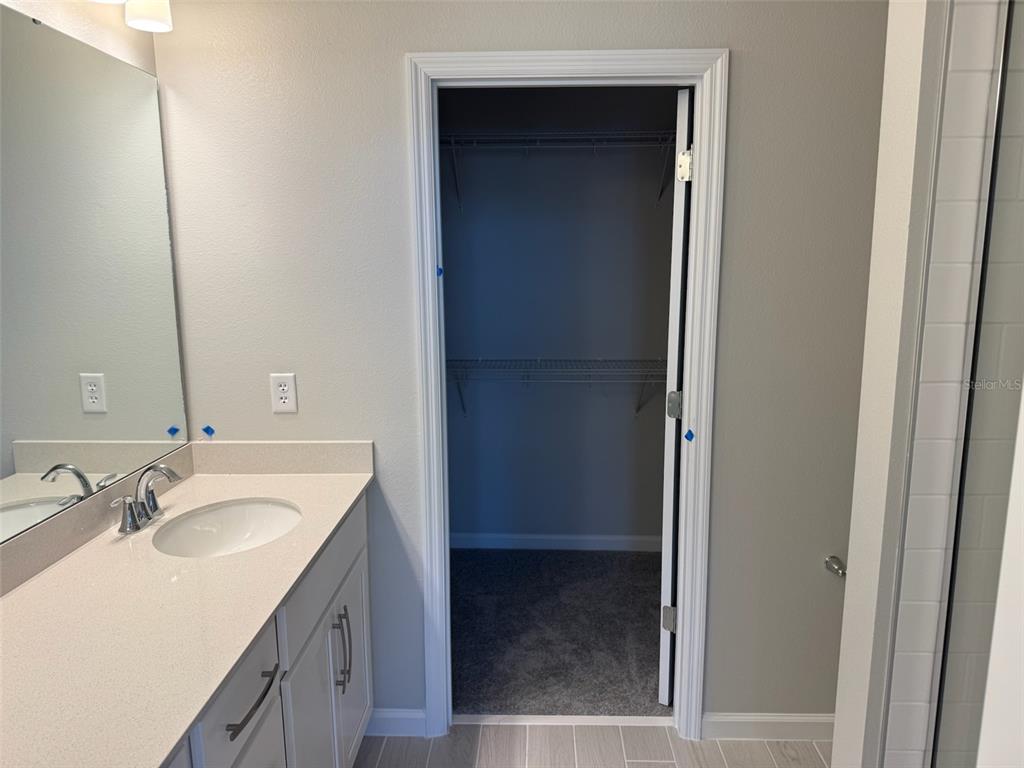 611 Pothos Street Apopka, FL 32703 - Photo 21 of 34 a bathroom with a sink and a mirror