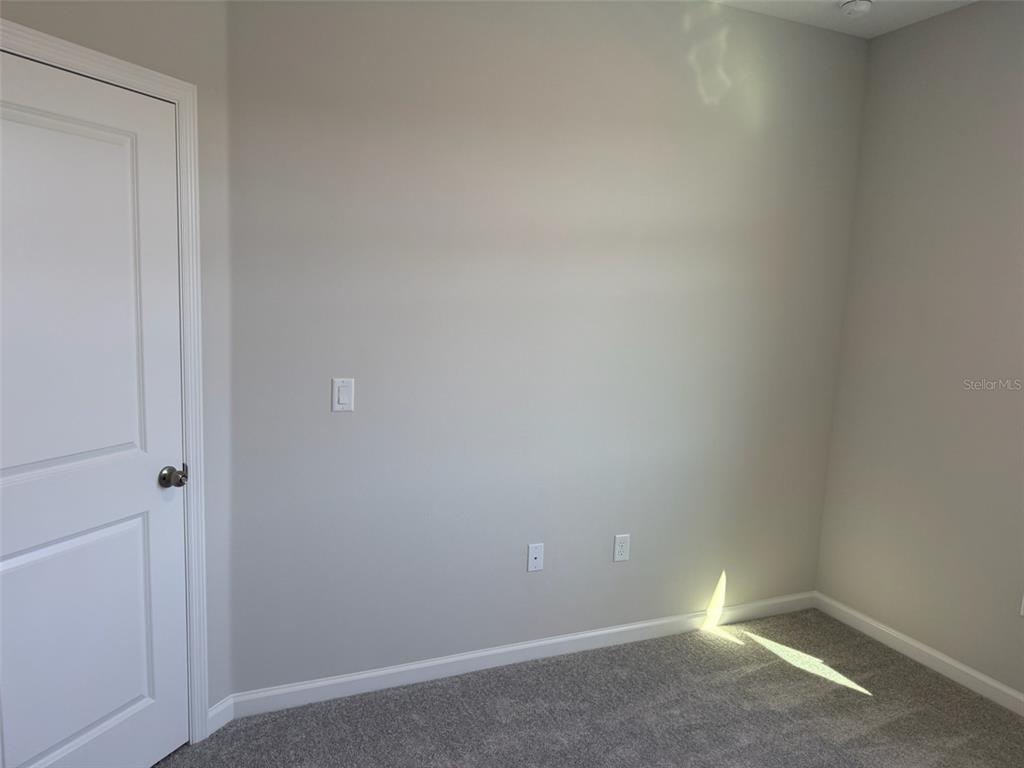 611 Pothos Street Apopka, FL 32703 - Photo 31 of 34 a room that has a window in it