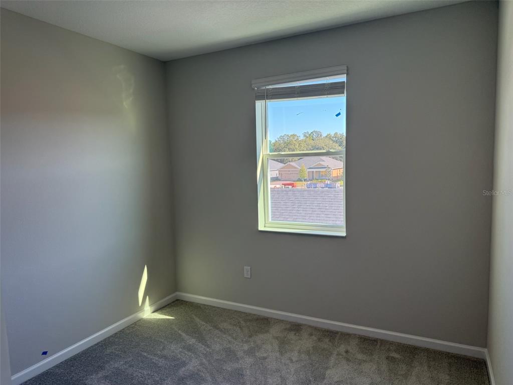 611 Pothos Street Apopka, FL 32703 - Photo 32 of 34 an empty room with a window
