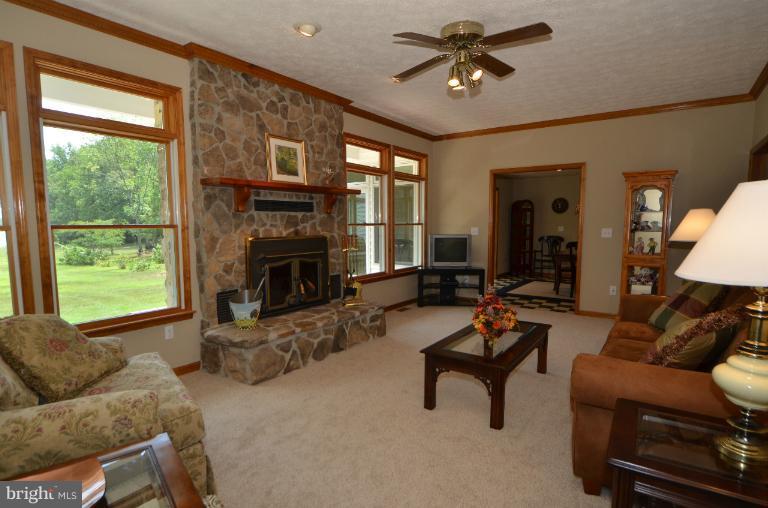 11034 Lucks Road Bumpass, VA 23024 - Photo 16 of 30 The family room enjoys lake views.