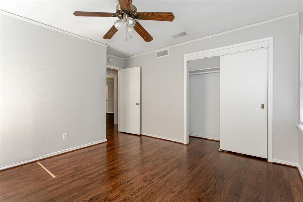 6520 St Moritz Avenue Dallas, TX 75214 - Photo 20 of 31 an empty room with wooden floor closet and fan