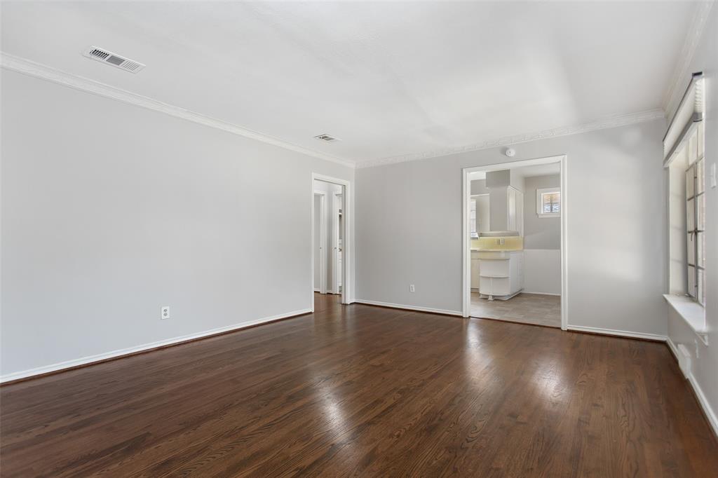 6520 St Moritz Avenue Dallas, TX 75214 - Photo 3 of 31 a view of wooden floor and windows in a room