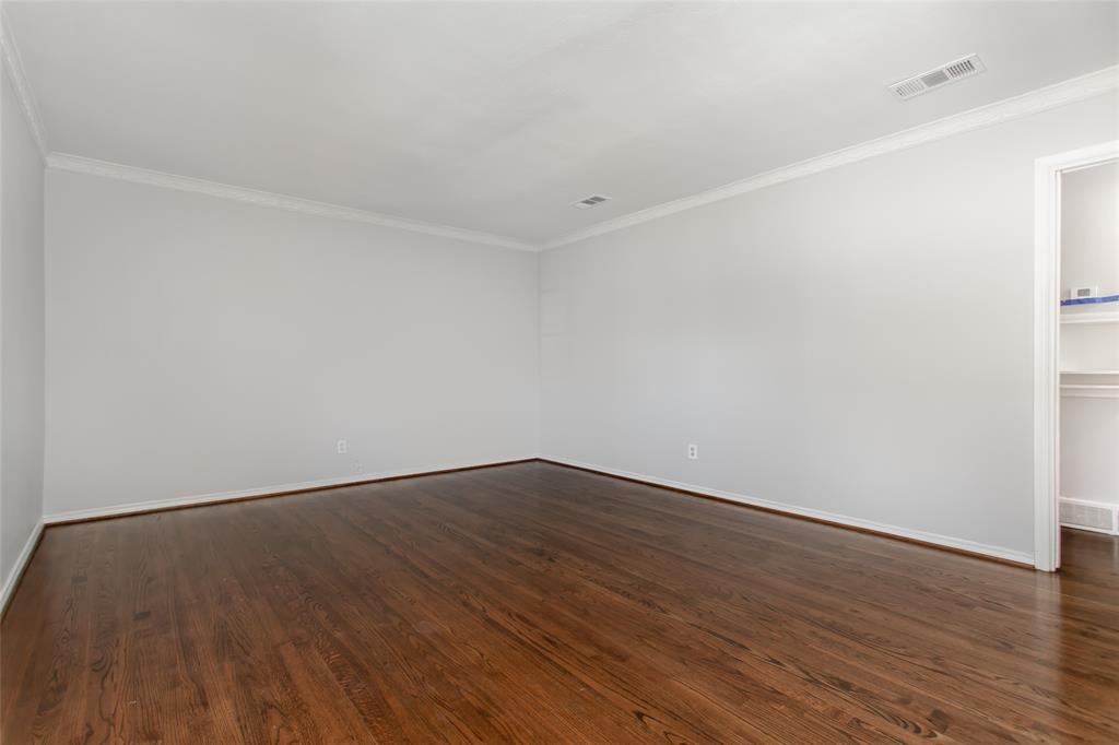 6520 St Moritz Avenue Dallas, TX 75214 - Photo 7 of 31 a view of an empty room with wooden floor