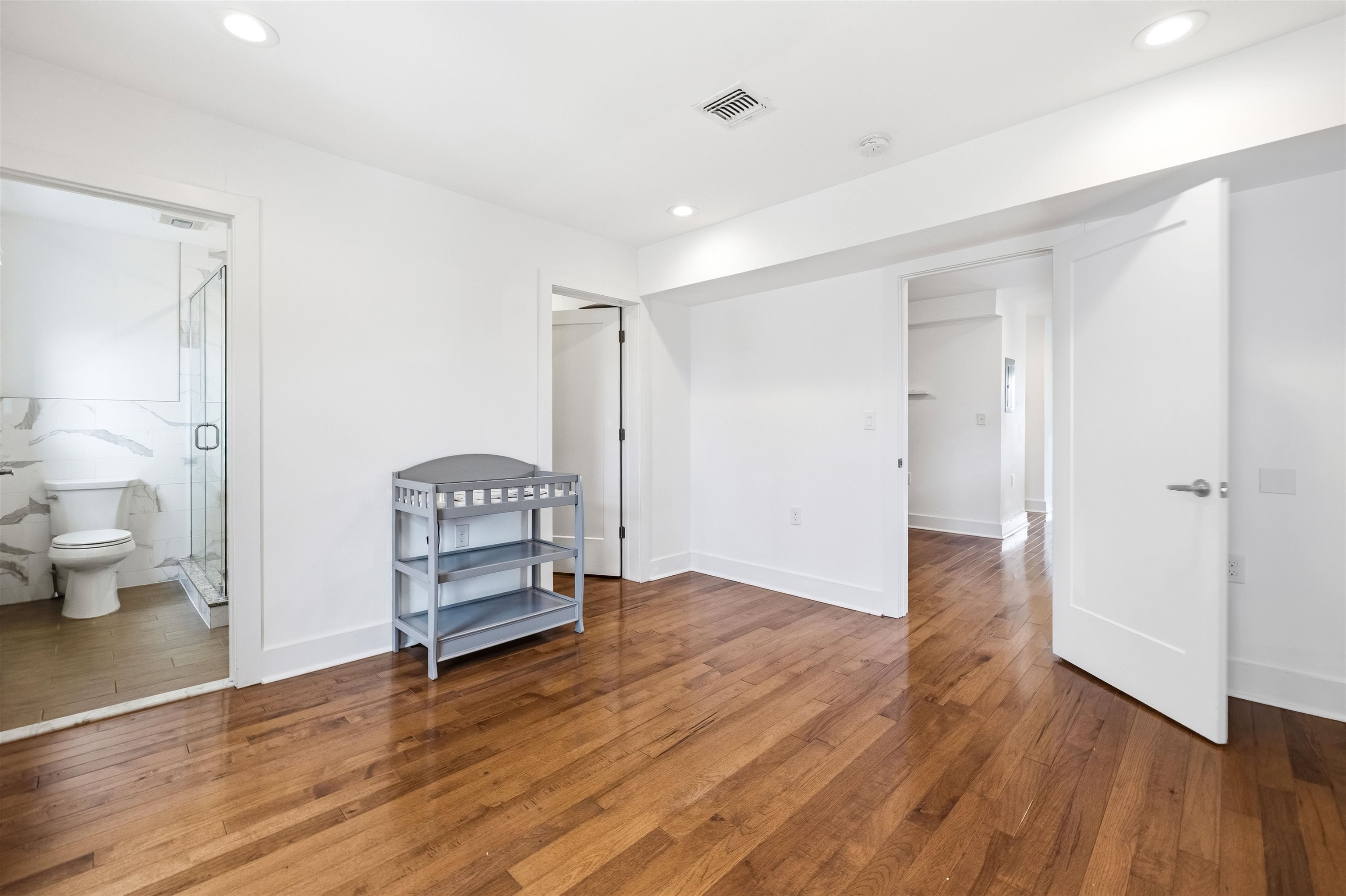 107 Mountain Road Jersey City, NJ 07307 - Photo 26 of 41 a view of empty room with wooden floor