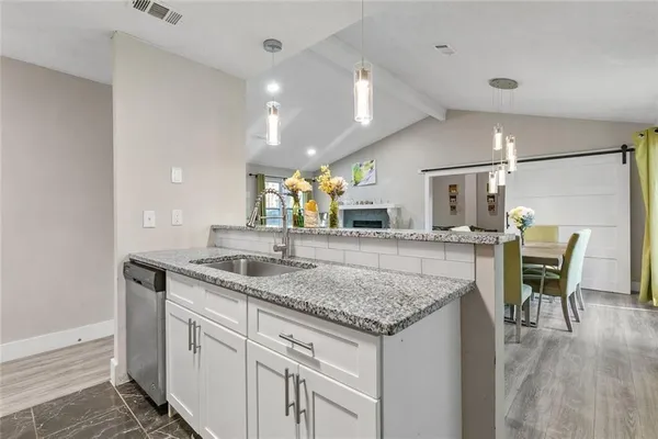 a kitchen with a table and chairs in it