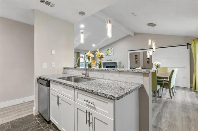 a kitchen with a table and chairs in it