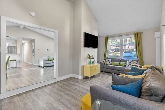 a living room with furniture and a flat screen tv