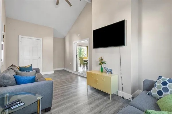 a living room with furniture and a flat screen tv