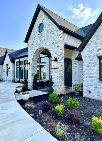 a front view of a house with garden