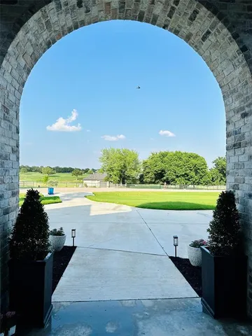 a view of a lake with a floor to ceiling window